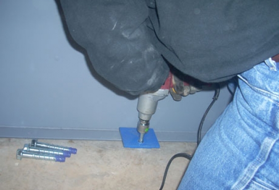 When securing the Tornado Tech Shelter’s anchor tabs, an impact wrench delivering over 200 ft/lbs of torque is used to install the large diameter tapcons.